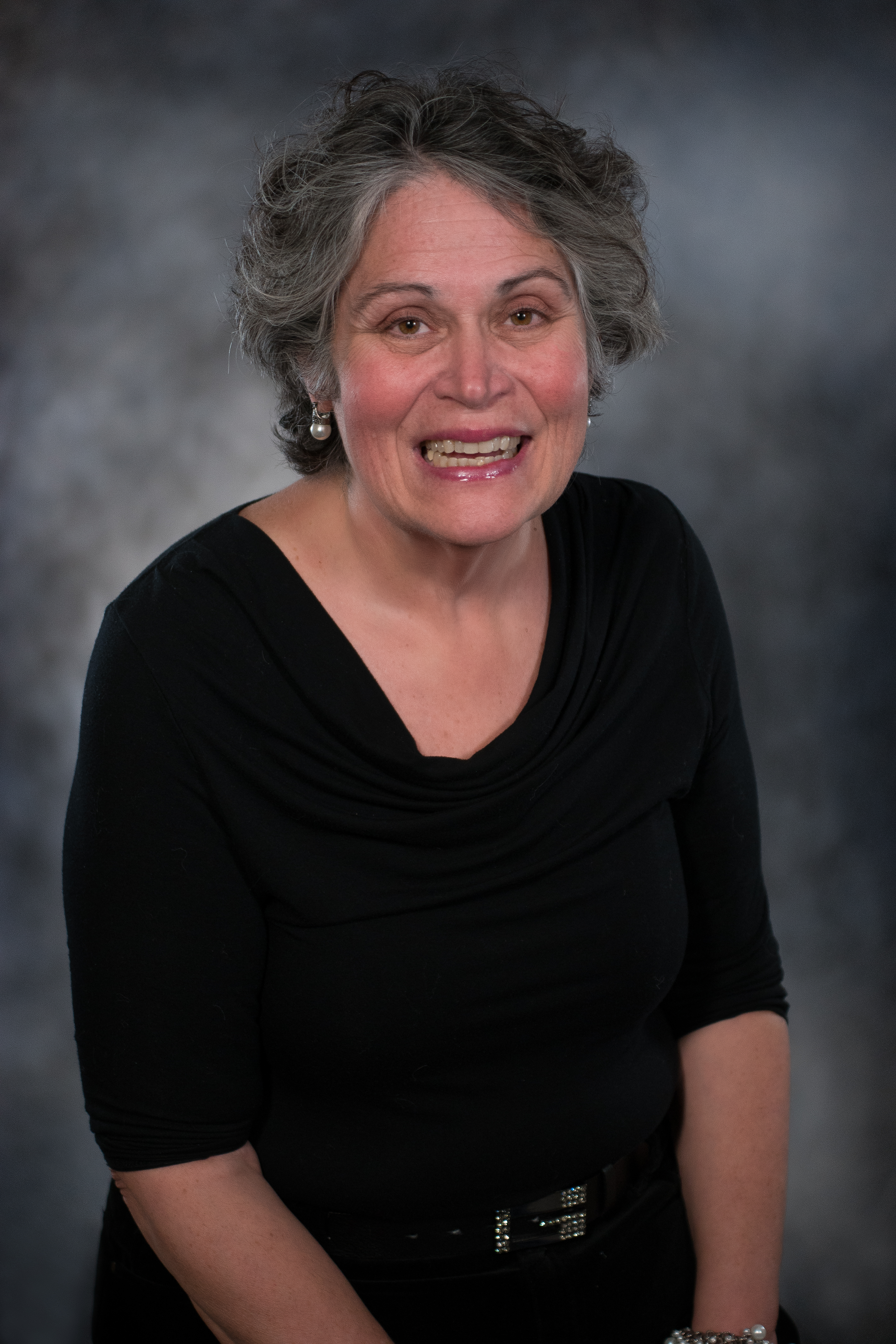 headshot of Sharon in a black blouse